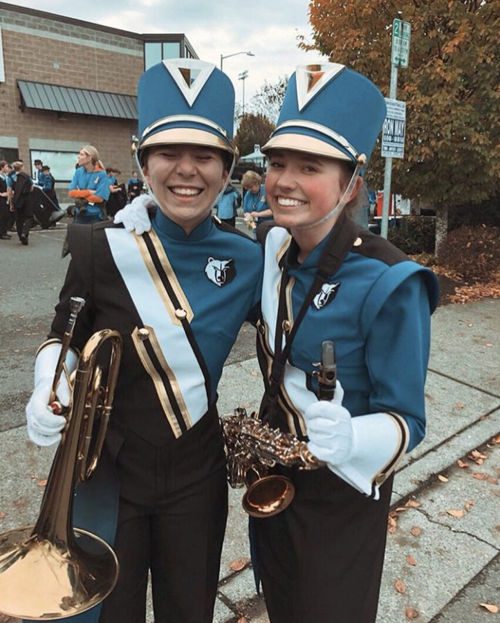 Freshmen Alexa Meyer and Sheridan Smith pose after a Tahoma High School Marching Band performance